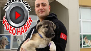 Polis memuru, kurtardığı köpeği sahiplendi